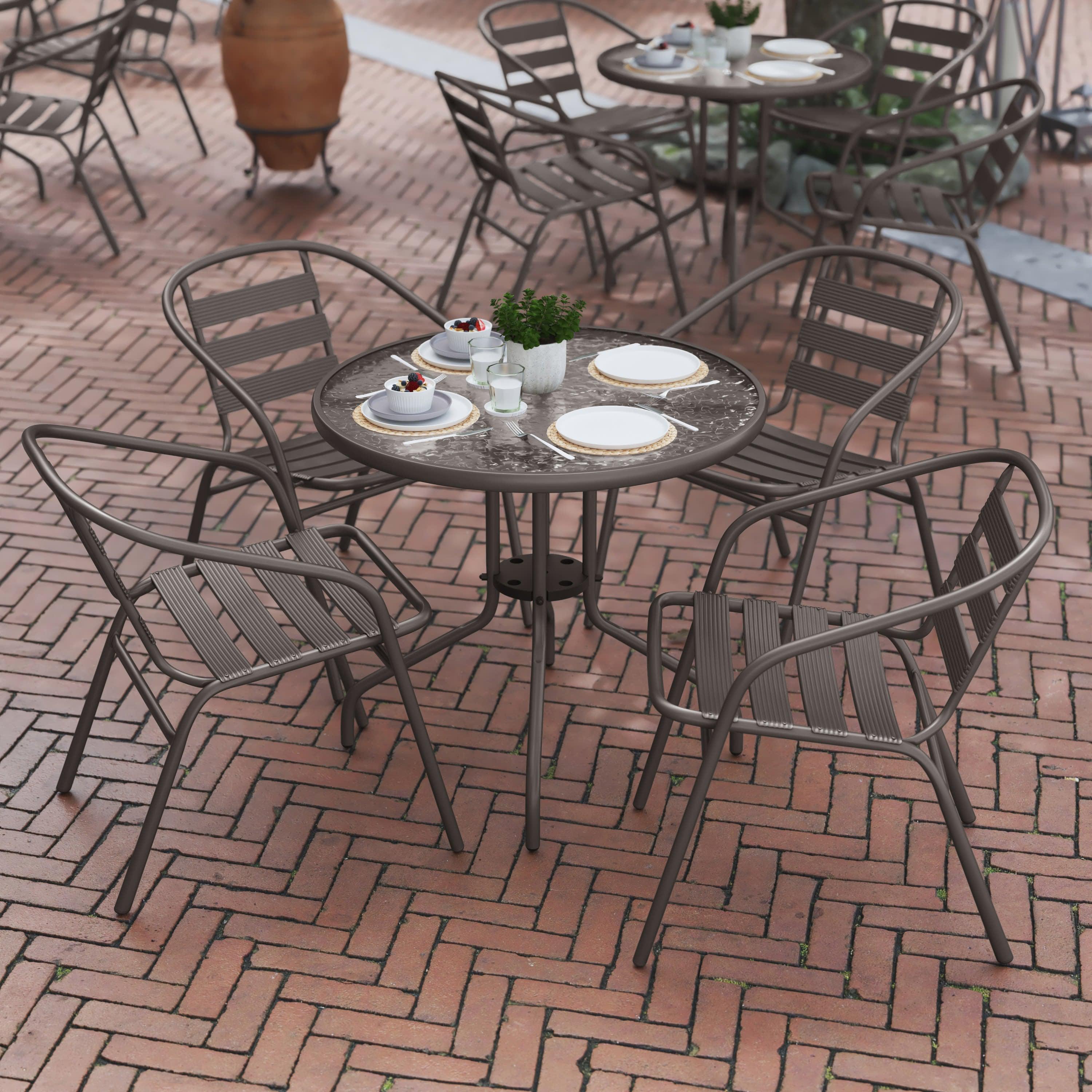round wrought iron table and 4 chairs